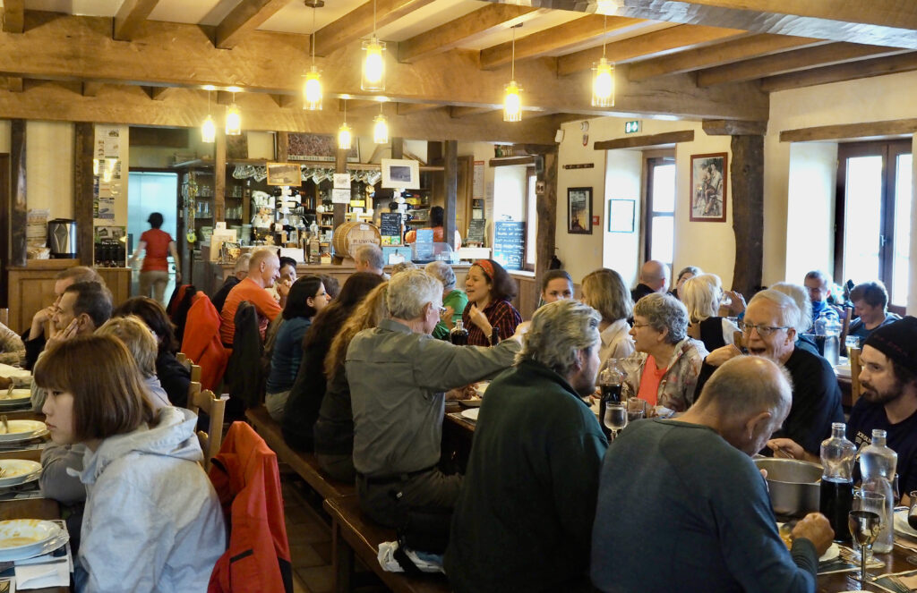 Orisson Refugio dining room filled with people eating a delicious and simple Camino supper