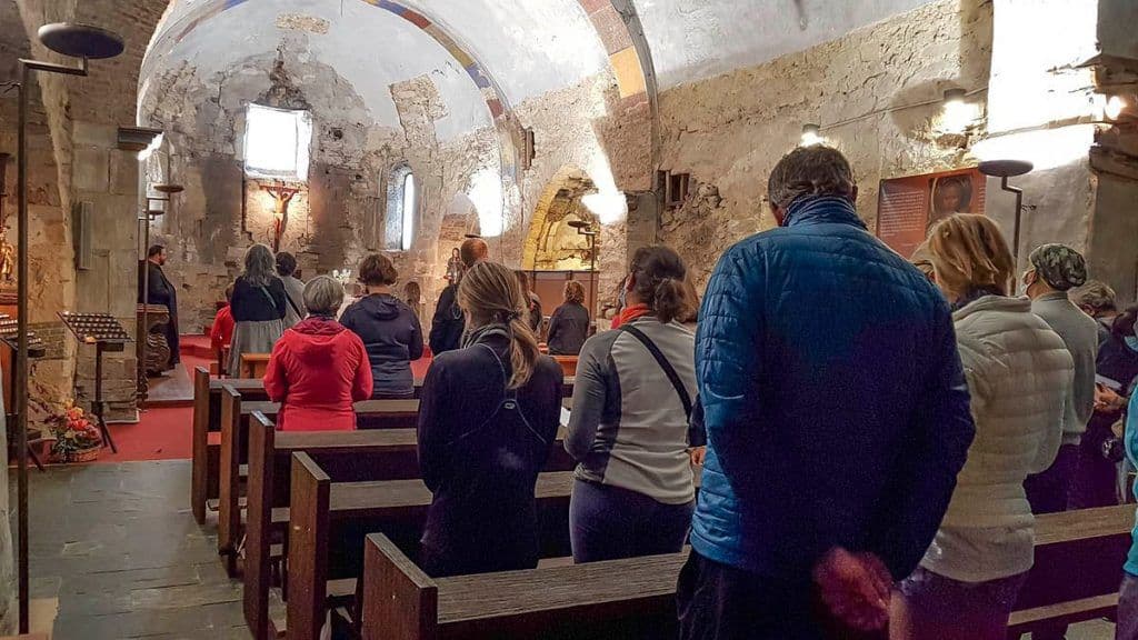 Worship at San Salvador monastery Worshiping congregation of pilgrims in the Chapel at San Salvador monastery