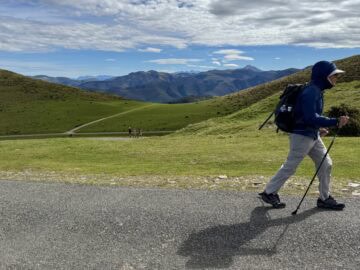 man with backpack walking in the Pyrenees on the Camino